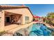 Stunning backyard pool with a covered patio, outdoor seating area, and well-maintained landscaping at 10851 E Sonrisa Ave, Mesa, AZ 85212