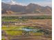 Aerial view of community with mountains in background at 12630 W Parkway Ln, Avondale, AZ 85323