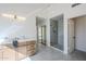 Modern bathroom with double vanity, walk-in shower, and access to bedroom at 15804 S 15Th Pl, Phoenix, AZ 85048