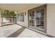 Covered patio with double doors leading into the home and a view of the backyard at 15804 S 15Th Pl, Phoenix, AZ 85048