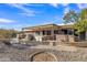 Outdoor patio area with built-in BBQ, stone bar, and spa at 15825 N 110Th Ave, Sun City, AZ 85351