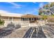 Backyard oasis with covered patio, BBQ area, and lattice fencing at 15825 N 110Th Ave, Sun City, AZ 85351