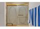 Bathroom with a shower and gold framed glass door at 15825 N 110Th Ave, Sun City, AZ 85351