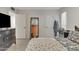 Bright bedroom with tiled floors and double doors leading to a patio at 15825 N 110Th Ave, Sun City, AZ 85351