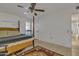 Bright bedroom with a ceiling fan and tiled floor at 15825 N 110Th Ave, Sun City, AZ 85351