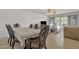 Dining area with a dark wood table and lace tablecloth at 15825 N 110Th Ave, Sun City, AZ 85351