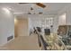 Dining room with glass table and ceiling fan at 15825 N 110Th Ave, Sun City, AZ 85351