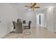 Dining room with glass table and ceiling fan at 15825 N 110Th Ave, Sun City, AZ 85351