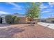 Tan single-story house with a tree and well-maintained front yard at 15825 N 110Th Ave, Sun City, AZ 85351