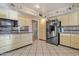 Full view of kitchen with granite counters and black appliances at 15825 N 110Th Ave, Sun City, AZ 85351