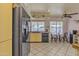 Kitchen with black appliances, yellow cabinets, and a breakfast nook at 15825 N 110Th Ave, Sun City, AZ 85351