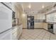 Open kitchen with granite countertops and yellow cabinets at 15825 N 110Th Ave, Sun City, AZ 85351
