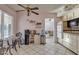 Kitchen features a breakfast nook and views into the living room at 15825 N 110Th Ave, Sun City, AZ 85351