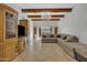 Living room showcases a large sectional sofa, wood beams, and built-in entertainment center at 15825 N 110Th Ave, Sun City, AZ 85351