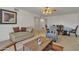 Bright and airy living room with comfortable seating and dining area at 15825 N 110Th Ave, Sun City, AZ 85351