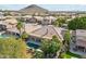 Aerial view showcasing home's backyard pool and surrounding landscape at 1714 E Saltsage Dr, Phoenix, AZ 85048