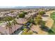 Aerial view of house with pool, golf course, and mountain views at 1714 E Saltsage Dr, Phoenix, AZ 85048
