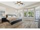 Spacious bedroom with wood floors and access to backyard at 1714 E Saltsage Dr, Phoenix, AZ 85048