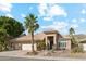 Single-story home with tile roof, two-car garage, and desert landscaping at 1714 E Saltsage Dr, Phoenix, AZ 85048