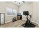 Bright home gym with exercise equipment and wood floors at 1714 E Saltsage Dr, Phoenix, AZ 85048