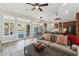 Bright living room with hardwood floors and view of the kitchen and pool at 1714 E Saltsage Dr, Phoenix, AZ 85048