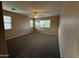 Bright bedroom featuring a large window and ceiling fan at 17322 W Carmen Dr, Surprise, AZ 85388