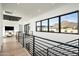 Bright hallway with modern railing and mountain views at 1831 E Palmaire Ave, Phoenix, AZ 85020