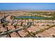 Aerial view showcasing homes, a lake, and a golf course at 189 E Atacama Ln, Queen Creek, AZ 85140