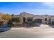 Single-story home with landscaped yard and two-car garage at 189 E Atacama Ln, Queen Creek, AZ 85140