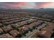 Aerial view of a residential community showcasing well-maintained homes, landscaping, and scenic mountain views at 189 E Atacama Ln, Queen Creek, AZ 85140