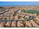 Aerial view of a luxury community with golf course and lake at 189 E Atacama Ln, Queen Creek, AZ 85140