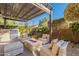Outdoor patio with fire pit and comfortable seating at 189 E Atacama Ln, Queen Creek, AZ 85140