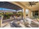 Outdoor living space featuring a fire pit and comfy seating at 189 E Atacama Ln, Queen Creek, AZ 85140