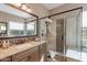 Bathroom with a large vanity and a walk-in shower at 189 E Atacama Ln, Queen Creek, AZ 85140