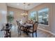 Elegant dining room with a large table and chandelier at 189 E Atacama Ln, Queen Creek, AZ 85140