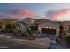 Beautiful single-story home with a well-manicured front yard, tile roof, and arched entryway at 189 E Atacama Ln, Queen Creek, AZ 85140