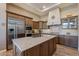 Spacious kitchen featuring wood cabinetry and a large island at 189 E Atacama Ln, Queen Creek, AZ 85140