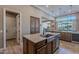 Island kitchen with stainless steel sink and farm-style faucet at 189 E Atacama Ln, Queen Creek, AZ 85140