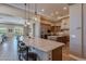 Open kitchen with curved breakfast bar and island at 189 E Atacama Ln, Queen Creek, AZ 85140