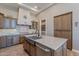 Kitchen with farmhouse sink and custom cabinetry at 189 E Atacama Ln, Queen Creek, AZ 85140
