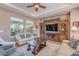 Bright living room boasts ample seating and a large TV at 189 E Atacama Ln, Queen Creek, AZ 85140