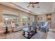 Comfortable living room with seating area and large windows at 189 E Atacama Ln, Queen Creek, AZ 85140