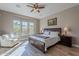 Serene main bedroom with a king-size bed and ample natural light at 189 E Atacama Ln, Queen Creek, AZ 85140