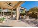 Covered patio with comfortable seating, fire pit and pergola at 189 E Atacama Ln, Queen Creek, AZ 85140