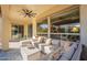 Covered patio with comfortable seating and large windows at 189 E Atacama Ln, Queen Creek, AZ 85140