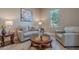 Bright sitting room with comfy seating and large window at 189 E Atacama Ln, Queen Creek, AZ 85140