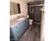 Bathroom with blue vanity and walk-in shower at 1920 W Lindner W Ave # 108, Mesa, AZ 85202