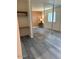 This bedroom features wood-look floors, large closet and a window with blinds at 1920 W Lindner W Ave # 108, Mesa, AZ 85202