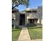 Charming condo complex with landscaped walkway, neutral stucco, and second-story balcony at 1920 W Lindner W Ave # 108, Mesa, AZ 85202