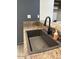 Close up of kitchen sink with black faucet and granite countertops at 1920 W Lindner W Ave # 108, Mesa, AZ 85202